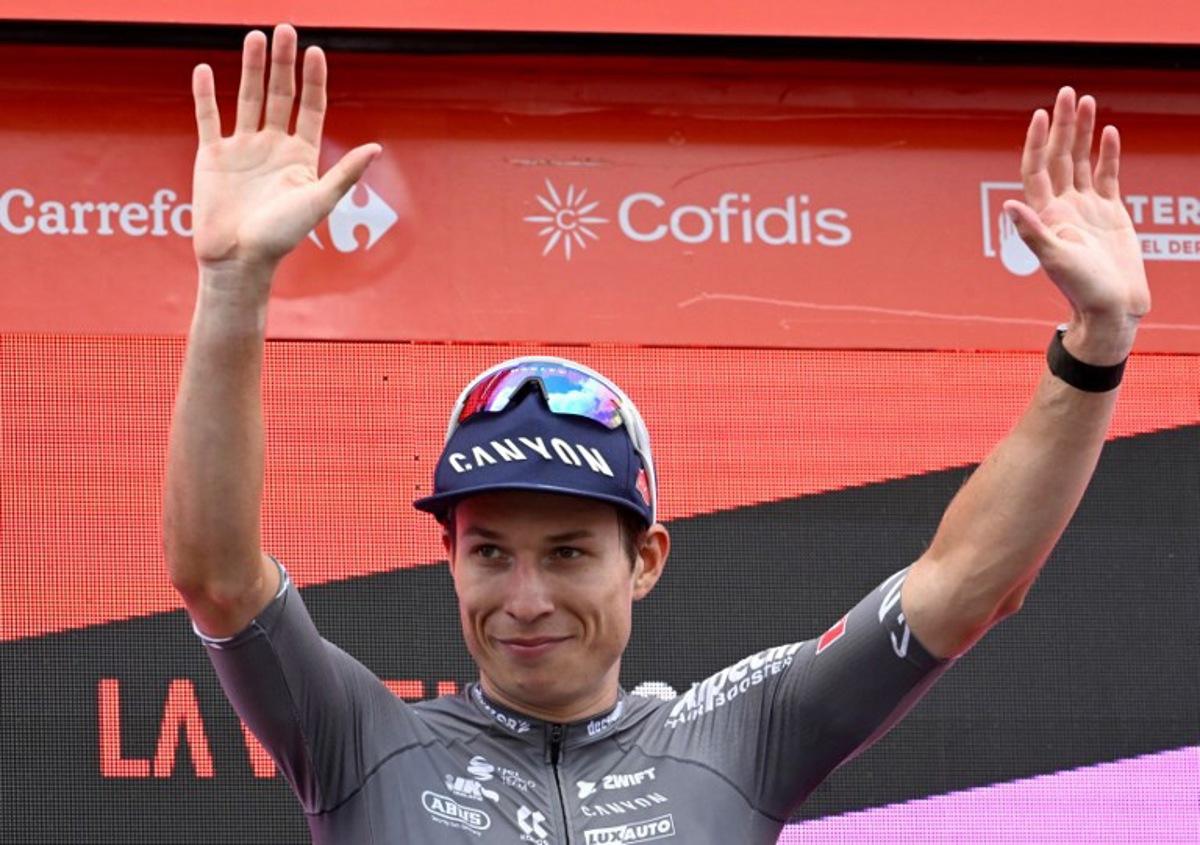 Stage winner team Alpecin's Belgian rider Jasper Philipsen celebrates on the podium after the 19th stage of the Vuelta a Espana, a 159 km race between Rueda and Guijuelo, on September 12, 2025. Miguel RIOPA / AFP