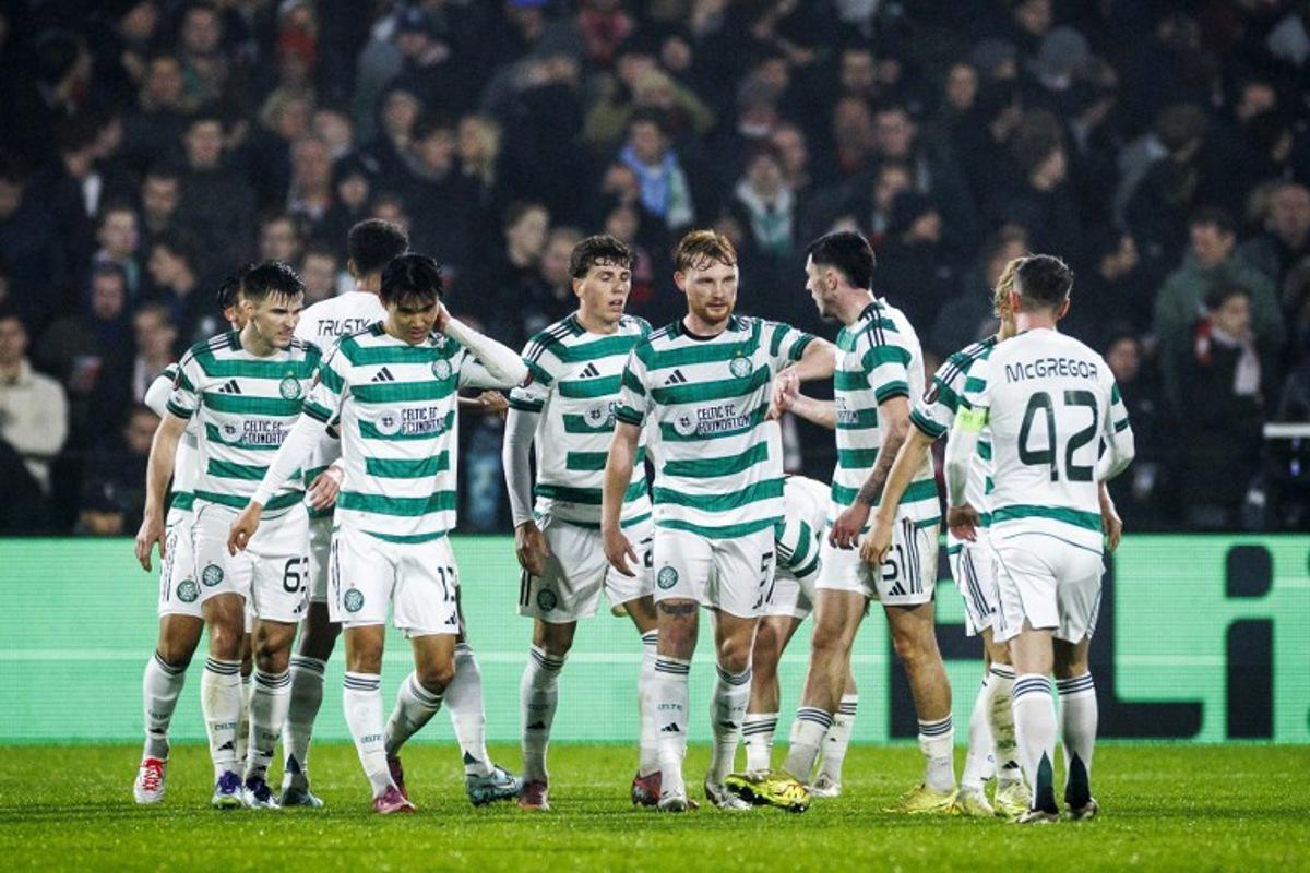 Players of Celtic FC celebrate their 1-2 goal during the UEFA Europa League football match Feyenoord Rotterdam and Celtic Glasgow at the Feyenoord Stadium 'De Kuip' in Rotterdam on Novemberr 27, 2025. Koen van Weel / ANP / AFP
