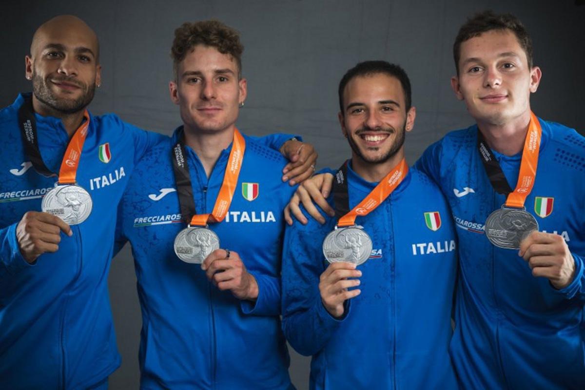 (From L to R) Men's 4x400 relay silver medallists Italy's Lamont Marcell Jacobs, Roberto Rigali, Lorenzo Patta, and Filippo Tortu pose for portraits during a studio photo session on the sidelines of the World Athletics Championships in Budapest on August 27, 2023. ANDREJ ISAKOVIC / AFP