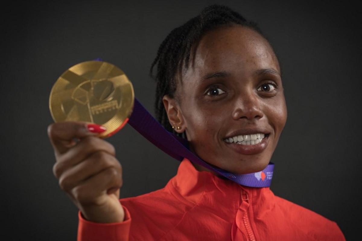 Women's 10000m final gold medallist Kenya's athlete Beatrice Chebet poses for portraits during a studio photo session on the sidelines of the World Athletics Championships in Tokyo on September 14, 2025. Andrej ISAKOVIC / AFP