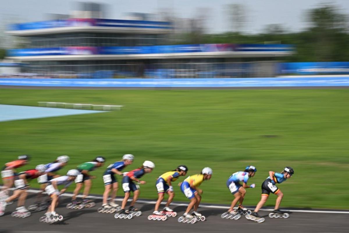Belgium's Jorun Geerts (1st-R) competes in the women's 100m speed skating road sprint semifinal during the 2025 World Games at the Shuyue Park in Chengdu, in China's southwestern Sichuan province on August 13, 2025. JADE GAO / AFP