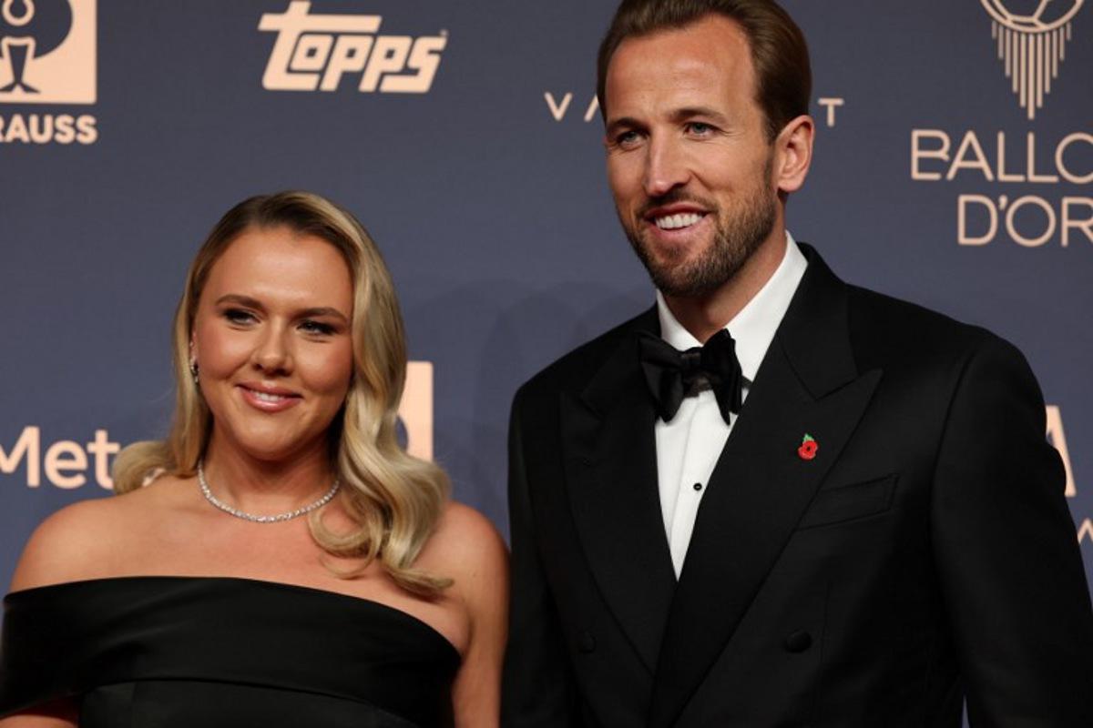 England and Bayern Munich forward Harry Kane and his wife Katie Goodland pose upon their arrival to attend the 2026 Ballon d'Or France Football award ceremony at the Palladium Theatre in London on October 26, 2026. FRANCK FIFE / AFP