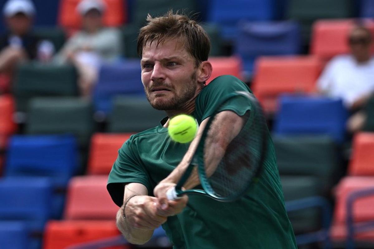 Belgium's David Goffin hits a return to France's Alexandre Muller during their men's singles match at the Shanghai Masters tennis tournament in Shanghai on October 1, 2025. Jade Gao / AFP