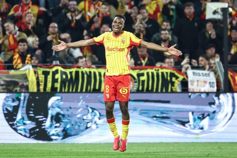 Lens' Malian midfielder #08 Mamadou Sangare celebrates scoring his team's third goal during the French L1 football match between RC Lens and SCO Angers at the Stade Bollaert-Delelis in Lens, northern France, on March 20, 2026. Sameer Al-DOUMY / AFP