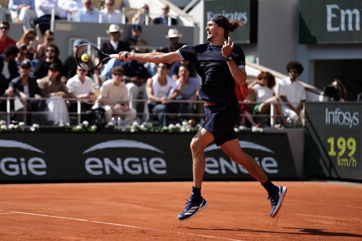 Germany's Alexander Zverev plays a forehand return to Italy's Flavio Cobolli during their mens final singles match on day 15 of the French Open tennis tournament on Court Philippe-Chatrier at the Roland-Garros Complex in Paris on June 7, 2026. Dimitar DILKOFF / AFP