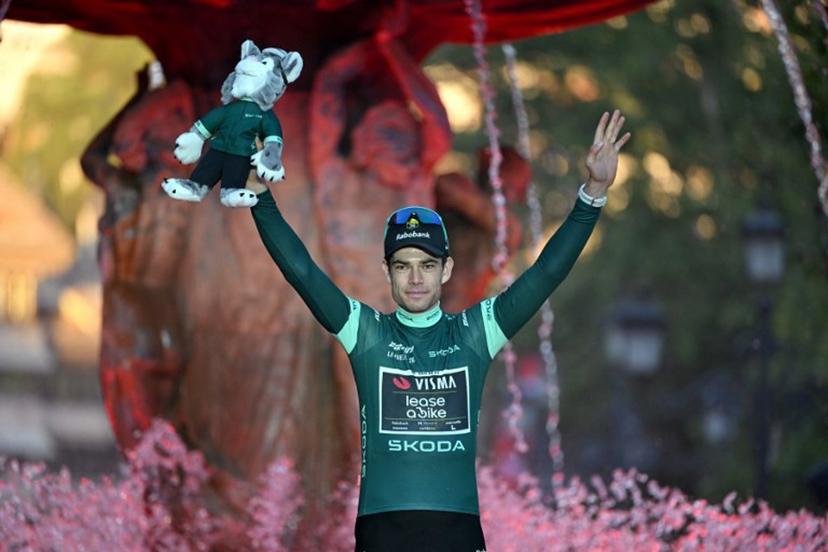 Team Visma-Lease a bike's Belgian rider Wout van Aert celebrates on the podium wearing the points leader's green jersey after the Vuelta a Espana 2026 cycling tour, a race over 3.275 kms in 21 stages and ending in Granada, on September 13, 2026. JORGE GUERRERO / AFP