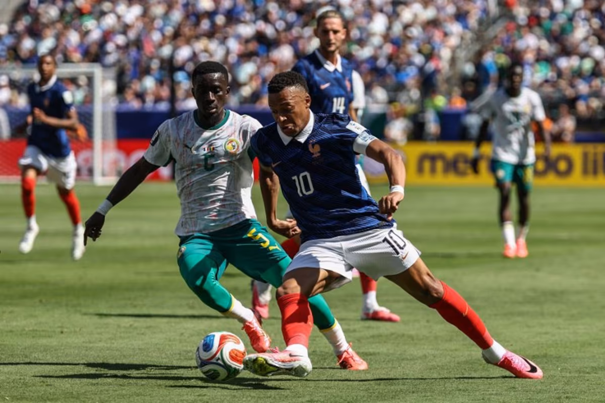 France's forward #10 Kylian Mbappe and Senegal's midfielder #05 Idrissa Gana Gueye fight for the ball during the 2026 World Cup Group I football match between France and Senegal at the New York/New Jersey Stadium in East Rutherford on June 16, 2026. FRANCK FIFE / AFP