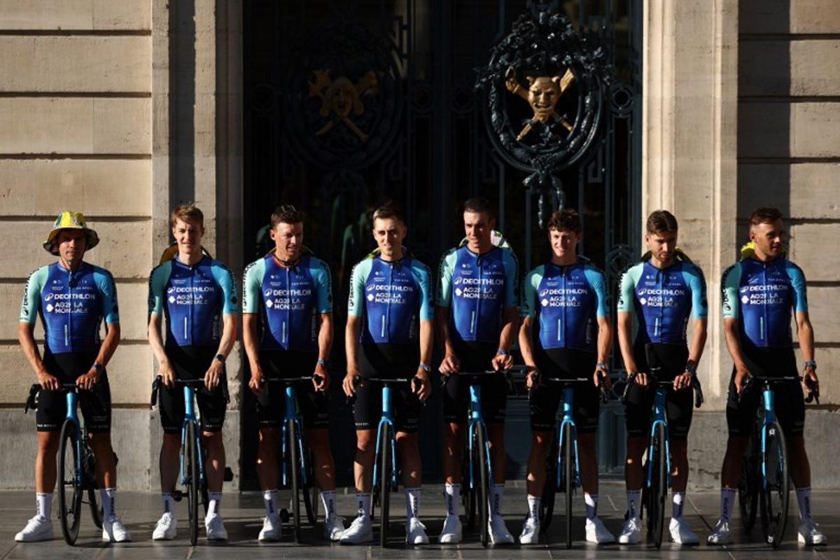 (From L) Decathlon AG2R La Mondial Team's Swiss rider Stefan Bissegger, Decathlon AG2R La Mondial Team's Australian rider Callum Scotson, Decathlon AG2R La Mondial Team's Belgian rider Oliver Naesen, Decathlon AG2R La Mondial Team's French rider Clement Berthet, Decathlon AG2R La Mondial Team's French rider Bruno Armirail, Decathlon AG2R La Mondial Team's Austrian rider Felix Gall, Decathlon AG2R La Mondial Team's French rider Aurelien Paret-Peintre and Decathlon AG2R La Mondial Team's French rider Bastien Tronchon pose during the official teams presentation days prior to the start of the 112th edition of the Tour de France cycling race, in Lille, northern France, on July 3, 2025. Anne-Christine POUJOULAT / AFP