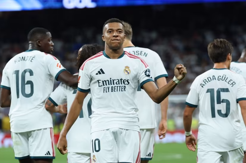 Real Madrid's French forward #10 Kylian Mbappe celebrates scoring his team's second goal during the Spanish league football match between Real Madrid CF and Real Sociedad at Santiago Bernabeu Stadium in Madrid on August 26, 2026. Thomas COEX / AFP