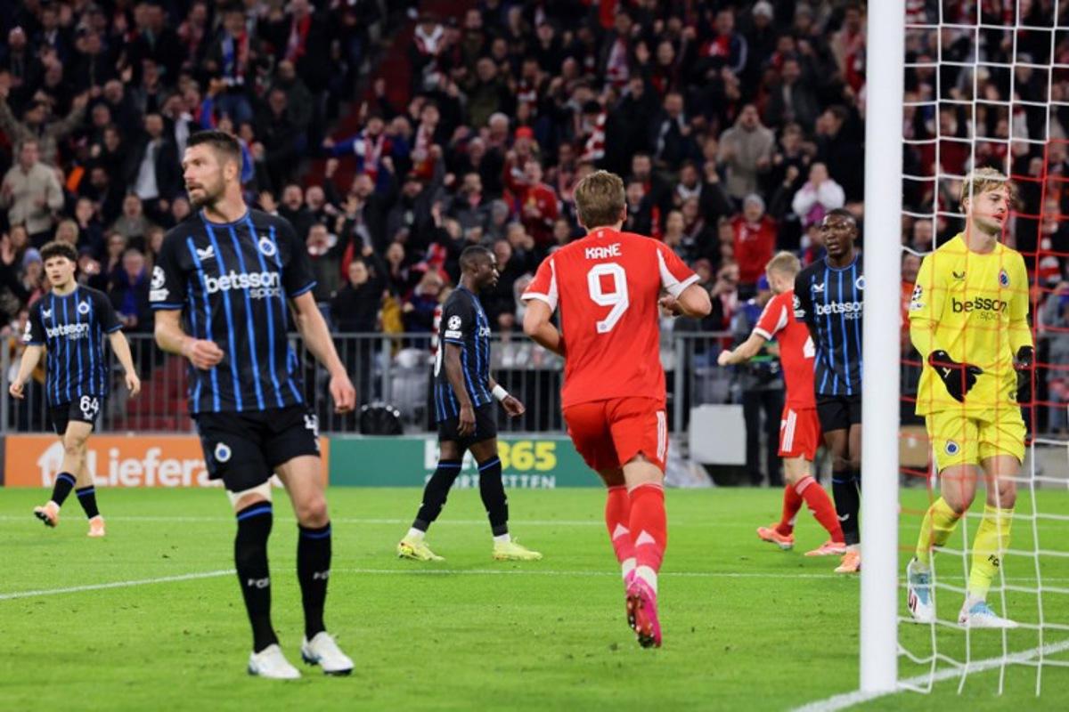 Bayern Munich's English forward #09 Harry Kane (C) celebrates scoring his team's second goal past Club Brugge's Belgian goalkeeper #29 Nordin Jackers (R) during the UEFA Champions League football match between FC Bayern Munich and Club Brugge in Munich, southern Germany on October 22, 2025. Alexandra BEIER / AFP