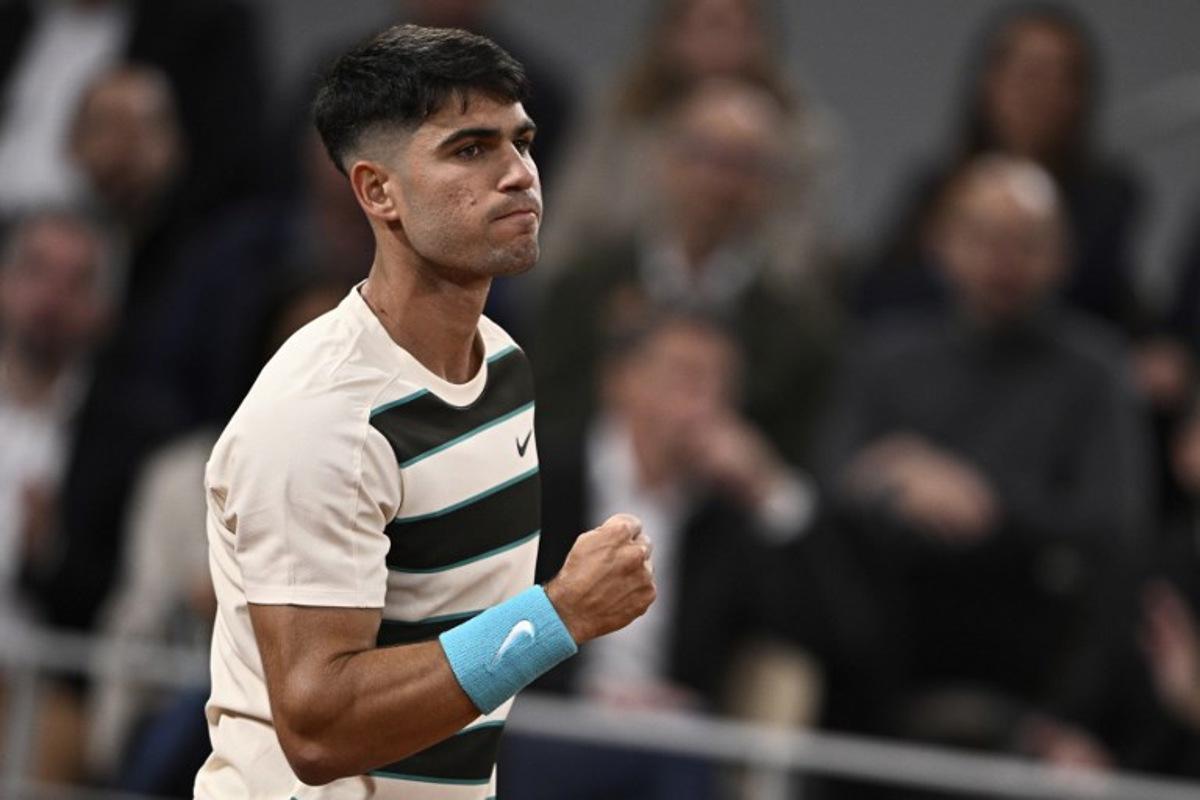 Spain's Carlos Alcaraz reacts to a point against Hungary's Fabian Marozsan during their men's singles match on day 4 of the French Open tennis tournament on Court Philippe-Chatrier at the Roland-Garros Complex in Paris on May 28, 2025. JULIEN DE ROSA / AFP