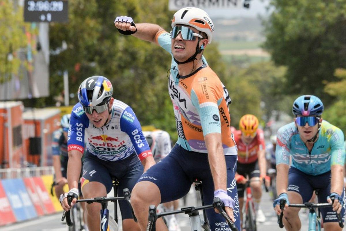 NSN Cycling Team's British rider Ethan Vernon (C) crosses the finish line to win stage four of the Tour Down Under UCI men's cycling race in Adelaide on January 24, 2026. Brenton Edwards / AFP