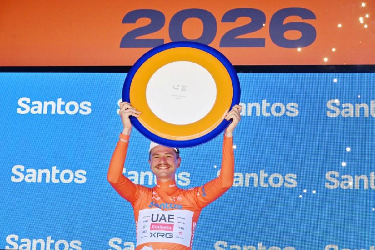 UAE Team Emirates XRG's Australian rider Jay Vine holds the winners trophy at the end of the Tour Down Under UCI men's cycling race in Adelaide on January 25, 2026. Brenton Edwards / AFP