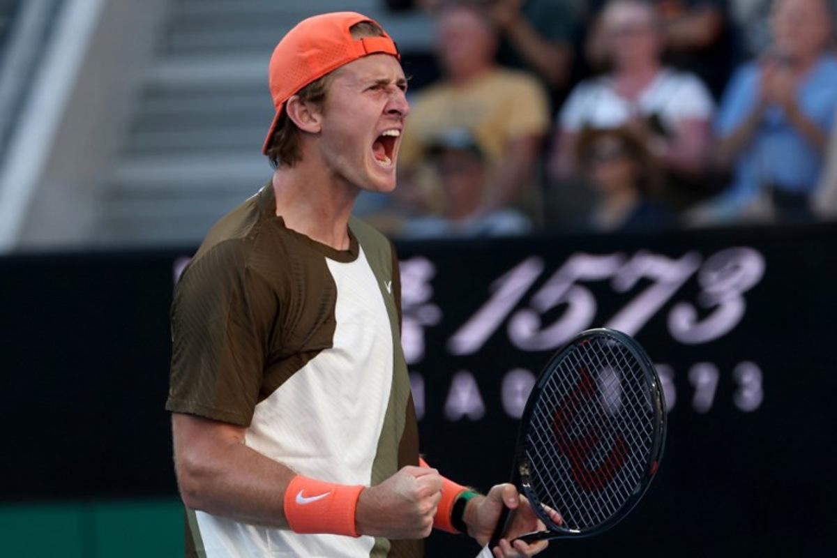 USA's Sebastian Korda celebrates winning the second set against compatriot Michael Zheng during their men's singles match on day one of the Australian Open in Melbourne on January 18, 2026. IZHAR KHAN / AFP
