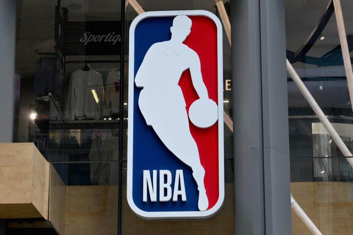The NBA logo is seen outside an NBA fan store in New York on July 8, 2024. ANGELA WEISS / AFP