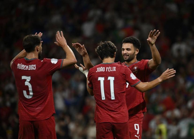 Portugal's forward #09 Goncalo Ramos celebrates with Portugal's forward #11 Joao Felix and Portugal's defender #03 Ruben Dias (L) scoring his team's second goal during the UEFA Nations League Group 4 football match between Portugal and Norway at Dragao stadium in Porto on October 3, 2026 Miguel RIOPA / AFP