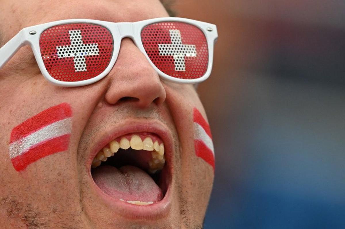 A Swiss fan cheers for his team ahead of the 2026 World Cup Group B football match between Switzerland and Bosnia and Herzegovina at Los Angeles Stadium in Inglewood on June 18, 2026. Patrick T. Fallon / AFP