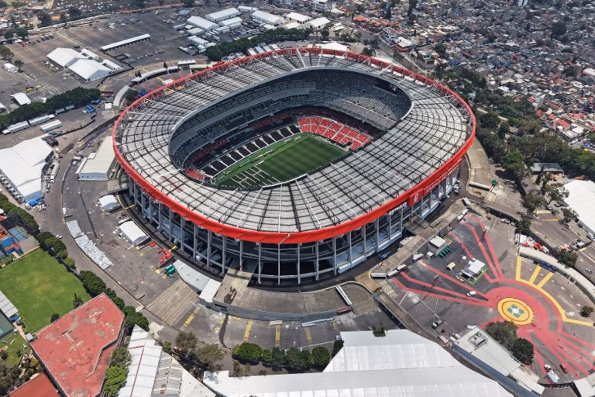 This aerial view shows the Mexico City Stadium, renamed from Azteca Stadium (or Banorte Stadium) for the FIFA World Cup, in Mexico City on May 28, 2026. FIFA temporarily branded the iconic Azteca Stadium as "Mexico City Stadium" for the 2026 World Cup, enforcing a strict "debranding" policy that requires all host stadiums to remove or cover non-official corporate sponsor names, suite branding, and external logos. Carl DE SOUZA / AFP