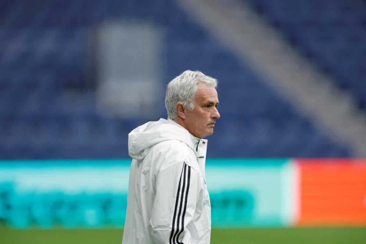 SL Benfica's Portuguese head coach Jose Mourinho looks on during a training on the eve of their UEFA Champions League knockout round play-off second leg football match against Real Madrid CF at Santiago Bernabeu Stadium in Madrid on February 24, 2026. Oscar DEL POZO / AFP