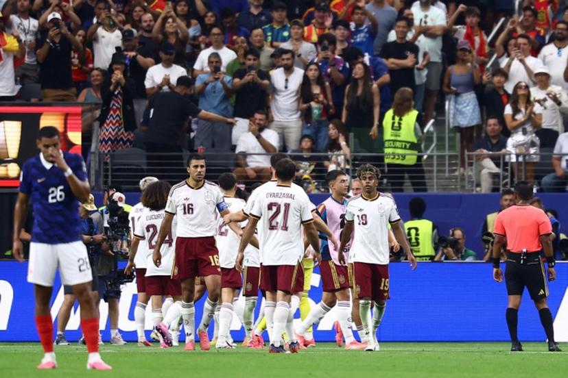 Spain's players celebrate after defender #12 Pedro Porro (unseen) scores his team's second goal during the 2026 World Cup football tournament semi-final match between France and Spain at the Dallas Stadium in Arlington on July 14, 2026. CHARLY TRIBALLEAU / AFP