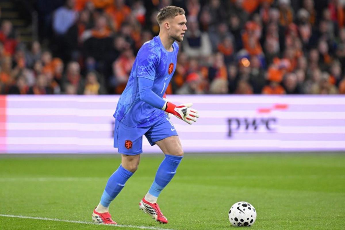 Netherlands' goalkeeper #01 Bart Verbruggen controls the ball during a friendly football match between the Netherlands and Norway at the Johan Cruijff Arena in Amsterdam on March 27, 2026. JOHN THYS / AFP