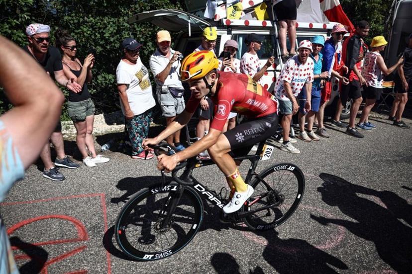 Uno-X Pro Cycling Team's Danish rider Anthony Charmig cycles in the final ascent of Col du Grand Combier in the final kilometeres of the 13th stage of the 110th edition of the Tour de France cycling race, 138 km between Chatillon-sur-Chalaronne in central-eastern France and Grand Colombier, in the Jura mountains in Eastern France, on July 14, 2023. Anne-Christine POUJOULAT / AFP