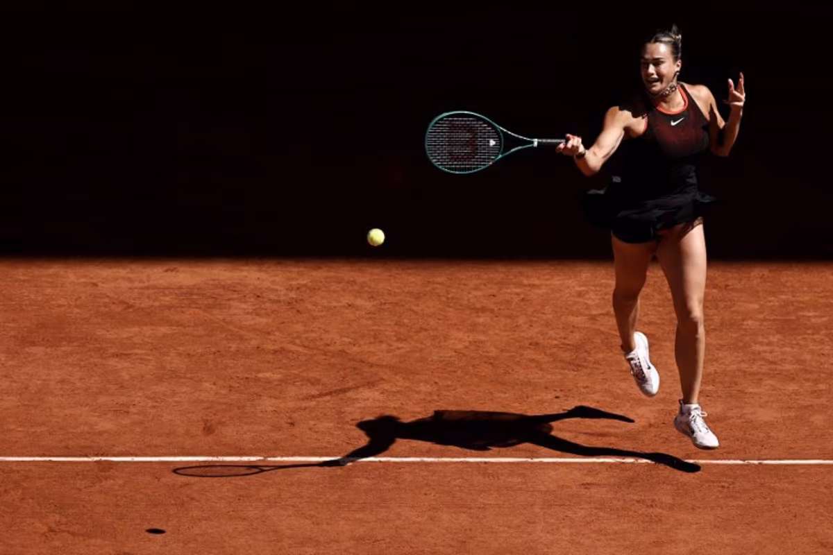 Belarus' Aryna Sabalenka plays a forehand return to Spain's Jessica Bouzas Maneiro during their women's singles match on day 3 of the French Open tennis tournament on Court Philippe-Chatrier at the Roland-Garros Complex in Paris on May 26, 2026. Anne-Christine POUJOULAT / AFP