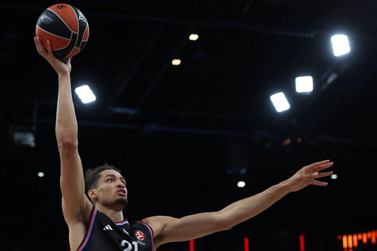 Paris Basketball's Belgian pivot #21 Ismael Bako holds the ball during the Euroleague basketball match between Paris Basketball and Virtus Bologna at the Adidas Arena, in Paris, on October 9, 2025. Anne-Christine POUJOULAT / AFP