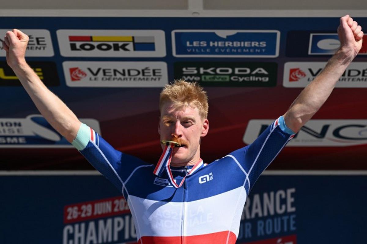 Decathlon-AG2R La Mondiale's French rider Dorian Godon poses with his medal after winning the men's Elite race of the French National Road Cycling championships, in Les Herbiers, western France, on June 29, 2025. Sebastien Salom-Gomis / AFP