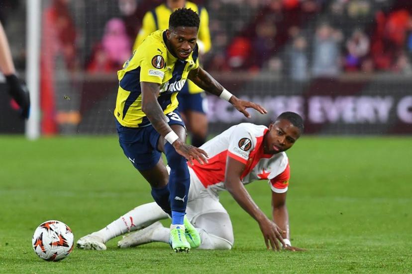 Slavia Prague's Cameroon forward #14 Simion Michez (R) fights for the ball with Fenerbahce's Brazilian midfielder #13 Fred during the UEFA Europa League football match between Slavia Prague and Fenerbahce SK in Prague, Czech Republic on November 28, 2024. Michal Cizek / AFP