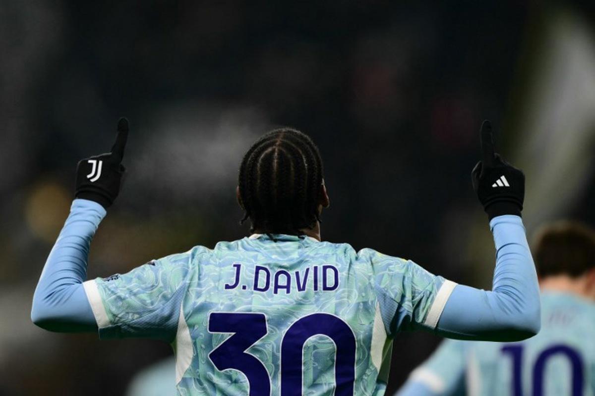 Juventus' Canadian forward #30 Jonathan David celebrates scoring his team's third goal during the Italian Serie A football match between Sassuolo and Juventus at the Mapei - Città del Tricolore stadium in Reggio Emilia, on January 6, 2026. Marco BERTORELLO / AFP