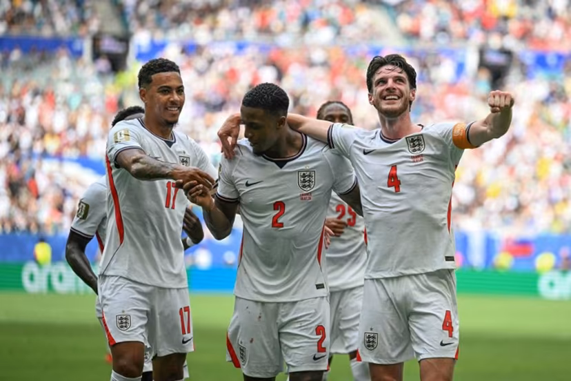 England's defender #02 Ezri Konsa celebrates scoring his team's second goal with England's midfielder #17 Morgan Rogers and England's midfielder #04 Declan Rice during the 2026 World Cup football tournament third-place match between France and England at the Miami Stadium in Miami on July 18, 2026. CHANDAN KHANNA / AFP