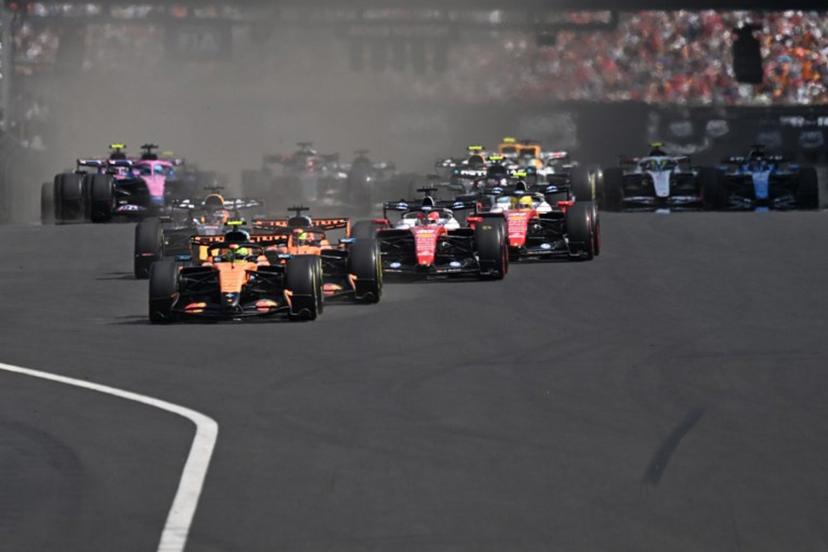 McLaren's British driver Lando Norris (C) followed by McLaren's Australian driver Oscar Piastri (C-R) and other cars compete during the Formula One Hungarian Grand Prix at the Hungaroring racetrack in Mogyorod near Budapest, Hungary, on July 26, 2026. Attila KISBENEDEK / AFP