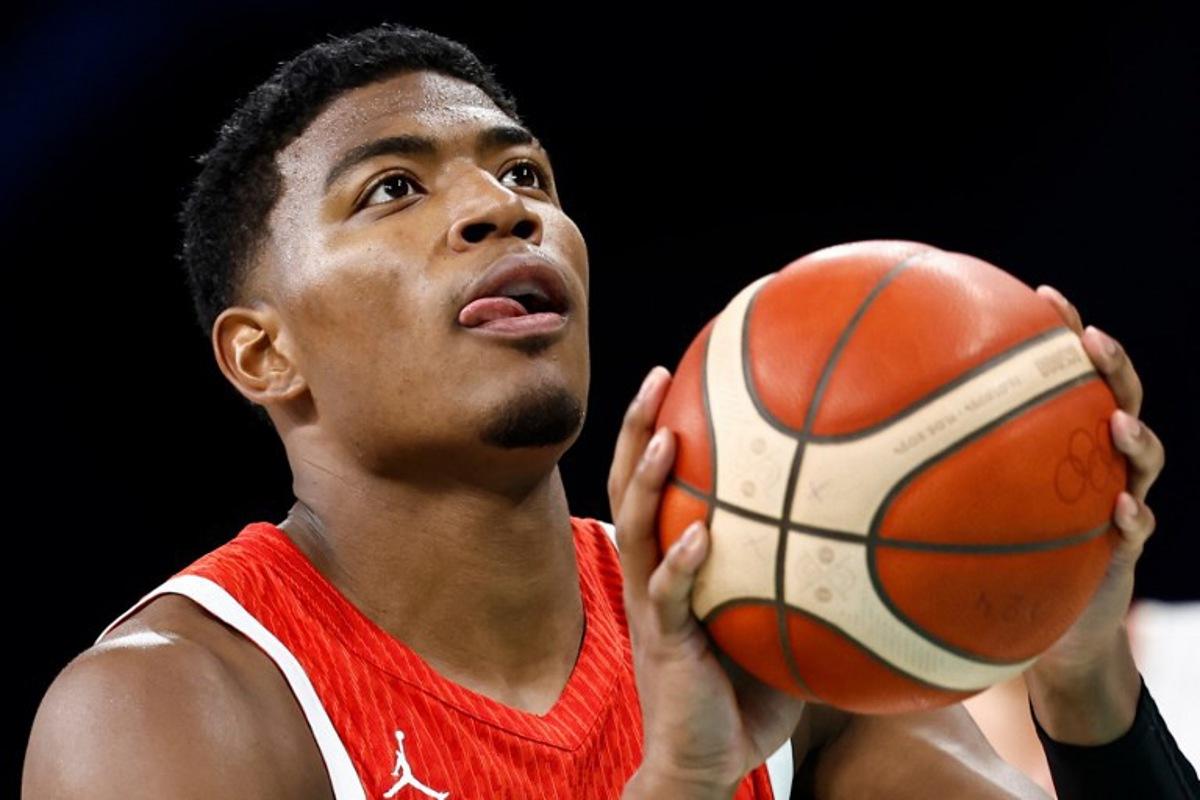 Japan's #08 Rui Hachimura takes a free throw in the men's preliminary round group B basketball match between Germany and Japan during the Paris 2024 Olympic Games at the Pierre-Mauroy stadium in Villeneuve-d'Ascq, northern France, on July 27, 2024. Sameer Al-Doumy / AFP