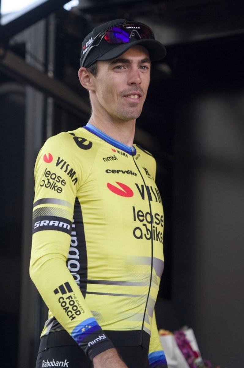 Second-placed Team Visma Lease a Bike team's French rider Christophe Laporte looks on, on the podium, after the 119th edition of the 211,6 km Paris-Tours one day cycling race, in Tours, central France on October 12, 2025. GUILLAUME SOUVANT / AFP