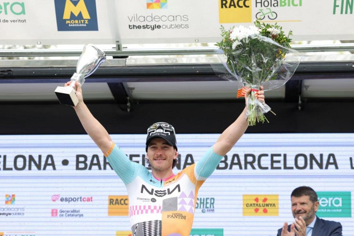 Team NSN Cycling Team's Australian rider Brady Gilmore celebrates on the podium winning the seventh and last stage of the 2026 'Volta a Catalunya' cycling tour of Catalonia, a 95,1 km race between Barcelona and Barcelona, on March 29, 2026. Josep LAGO / AFP