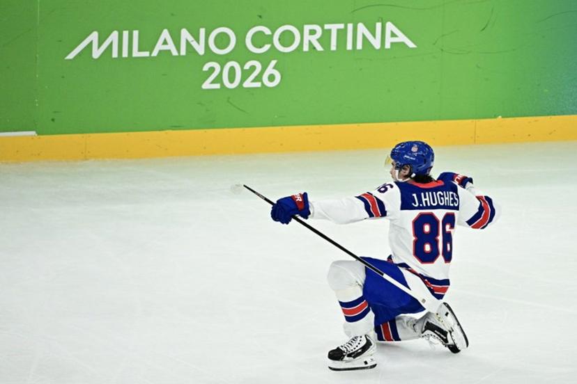 USA's #86 Jack Hughes celebrates scoring the 3-0 goal during the men's play-off semi-final ice hockey match between USA and Slovakia at the Milano Santagiulia Ice Hockey Arena during the Milano Cortina 2026 Winter Olympic Games in Milan, on February 20, 2026. JULIEN DE ROSA / AFP