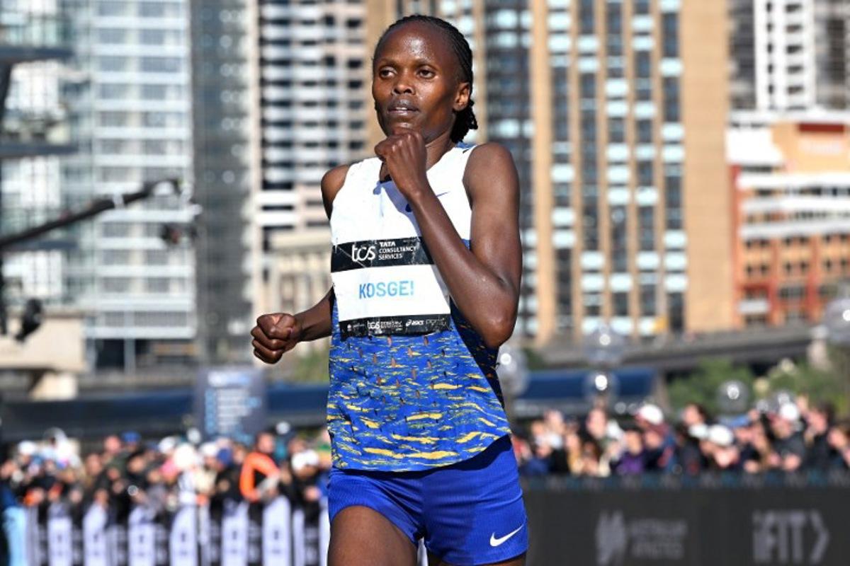 Kenya's Brigid Kosgei crosses the finish line in second place during the 2025 Sydney Marathon at the Opera House on August 31, 2025. Saeed KHAN / AFP