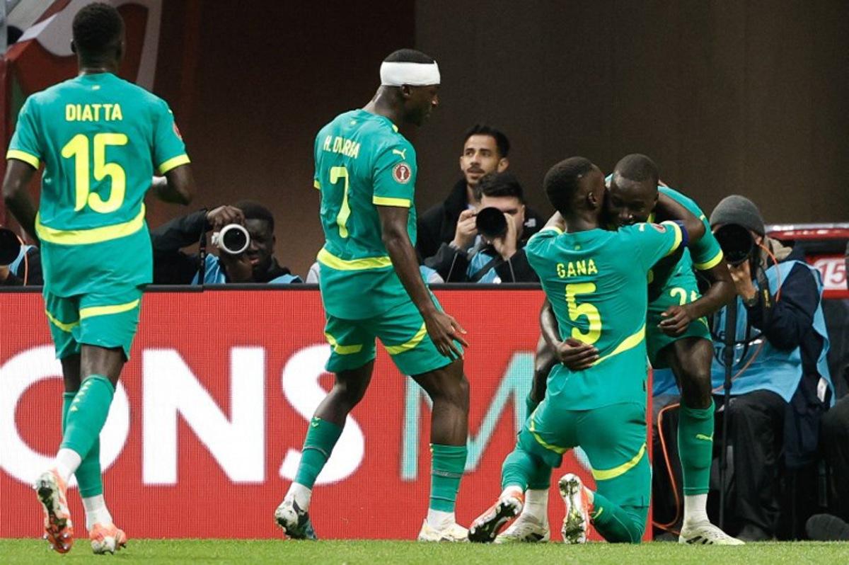 Senegal's midfielder #26 Pape Gueye (R) celebrates scoring his team's second goal with Senegal's midfielder #05 Idrissa Gueye (2R) during the Africa Cup of Nations (CAN) round of 16 football match between Senegal and Sudan at Grand Stadium in Tangiers on January 3, 2026. Abdel Majid BZIOUAT / AFP