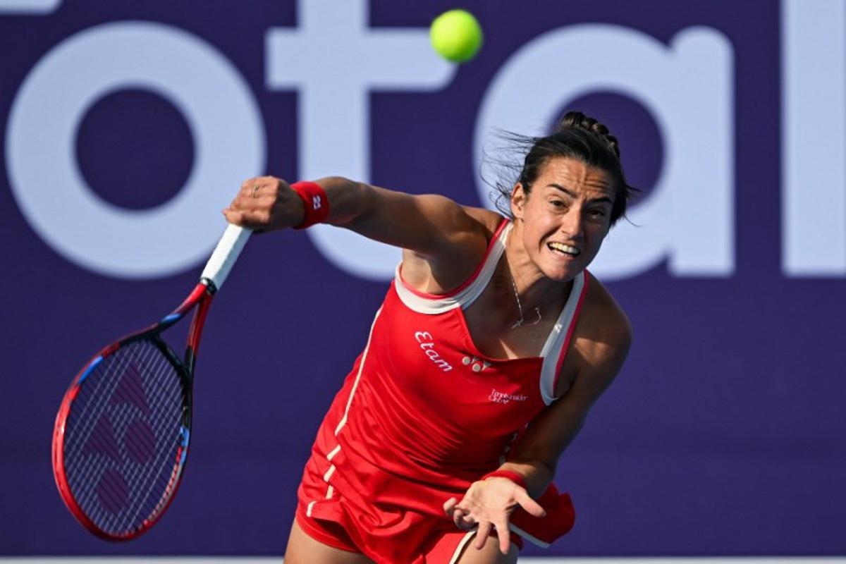 Caroline Garcia of France returns the ball to Jasmine Paolini of Italy during their 2025 WTA Qatar Open match at the Khalifa International Tennis Complex in Doha on February 11, 2025. Mahmud HAMS / AFP