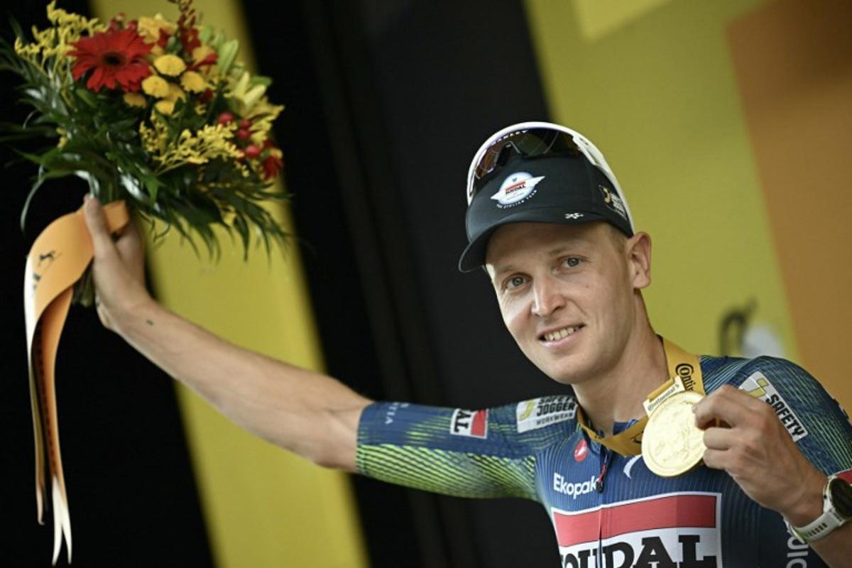 Soudal Quick-Step team's Belgian rider Tim Merlier celebrates on the podium after winning the 12th stage of the 113th edition of the Tour de France cycling race, 179,1 km between Circuit de Nevers Magny-Cours and Chalon-sur-Saône in central France, on July 16, 2026. Loic VENANCE / AFP