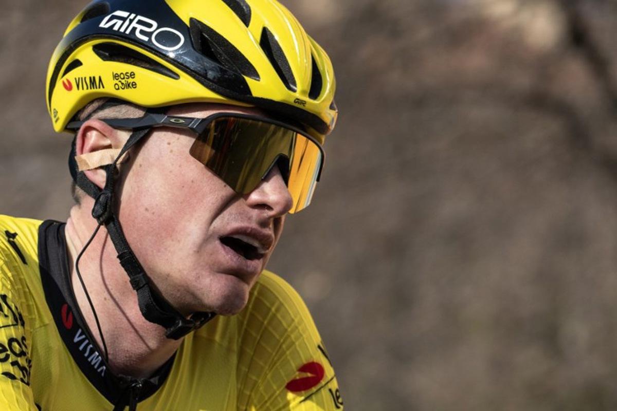 Second-placed Team Visma Lease a Bike, British Ben Tulett reacts after crossing the finish line of the 106th edition of the one-day classic cycling race Milan - Torino between Rho, west of Milan, and Superga, east of Torino, on March 19, 2025. MARCO BERTORELLO / AFP