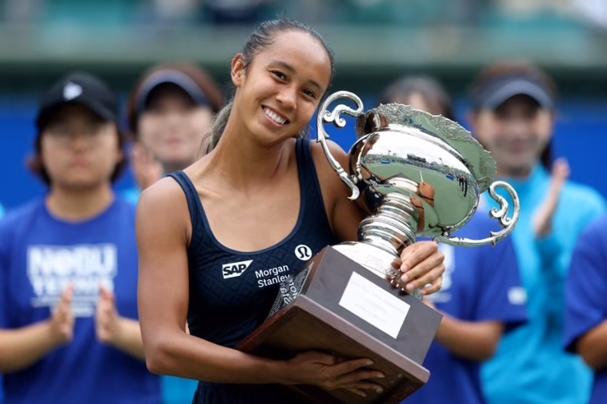 Canada's Leylah Fernandez poses with the winner's trophy after defeating Czech Republic's Tereza Valentova in their women's singles final match at the Japan Open tennis tournament in Osaka on October 19, 2025. PAUL MILLER / AFP