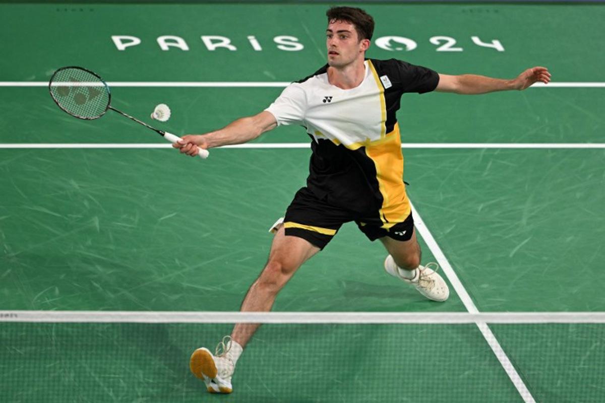 Belgium's Julien Carraggi plays a shot against India's Lakshya Sen in their men's singles badminton group stage match during the Paris 2024 Olympic Games at Porte de la Chapelle Arena in Paris on July 29, 2024. Arun SANKAR / AFP