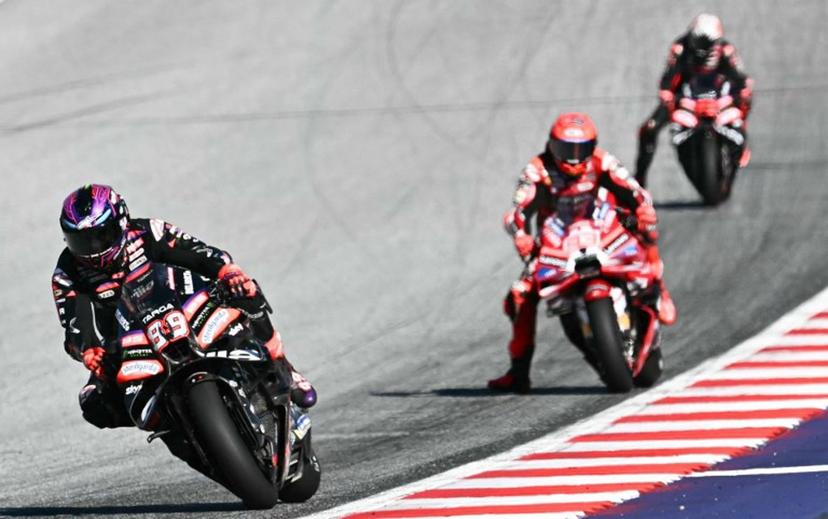 Aprilia Racing's Spanish driver Jorge Martin (L) and Ducati Lenovo Team's Spanish driver Marc Marquez compete during the Sprint event of the Grand Prix of Austria MotoGP in Spielberg bei Knittelfeld, Austria, on September 19, 2026. Joe Klamar / AFP