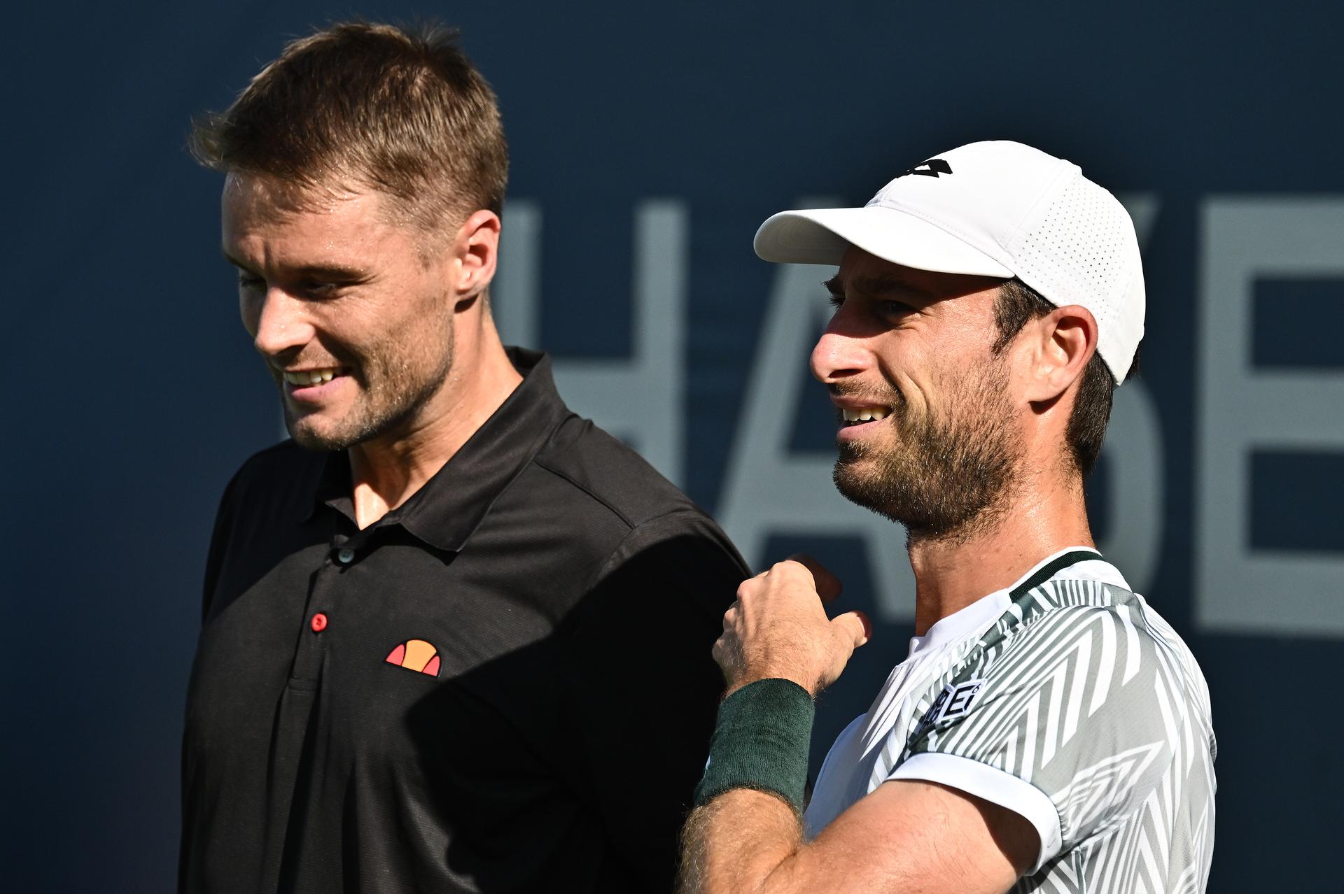 Sander Gille (white hat) of Belgium and partner Sam Verbeek of the Netherlands tap as they play Alexander Blockx of Belgium and Dino Prizmic of Croatia during the Men's doubles Round 1 of the 2026 US Open Tennis Championship, USTA Billie Jean King National Tennis Center in Flushing Meadow-Corona Park, in the Queens borough of New York, NY, September 4, 2026. (Photo by Anthony Behar/Sipa USA) BELGA PHOTO BENELUX ONLY