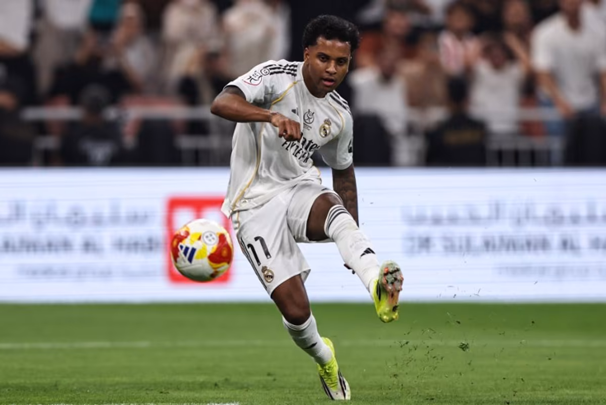 Real Madrid's Brazilian forward #11 Rodrygo kicks the ball during the Spanish Supercup semi-final football match between Atletico Madrid and Real Madrid at King Abdullah Sports City in Jeddah on January 8, 2026. Fadel SENNA / AFP