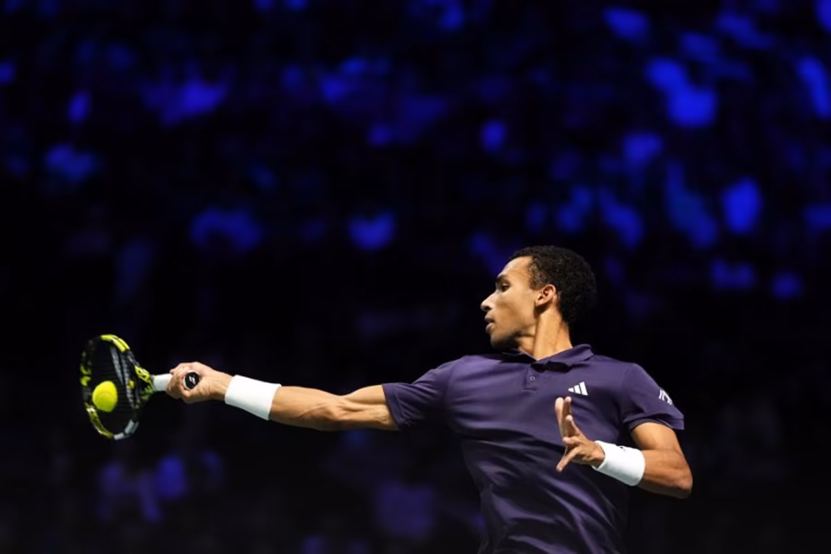 Canada's Felix Auger-Aliassime plays a forehand return to Kazakhstan's Alexander Bublik during their men's singles semi-final match on day six of the Paris ATP Masters 1000 tennis tournament at the Paris La Défense Arena in Nanterre, on the outskirts of Paris, on November 1, 2025. Dimitar DILKOFF / AFP
