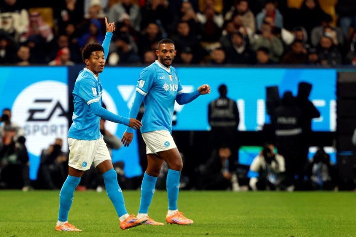 SCC Napoli's #7 David Neres (L) celebrates his goal during the Italian Super Cup semi-final match between SCC Napoli and AC Milan at King Saud University Stadium in Riyadh on December 18, 2025. Fayez Nureldine / AFP