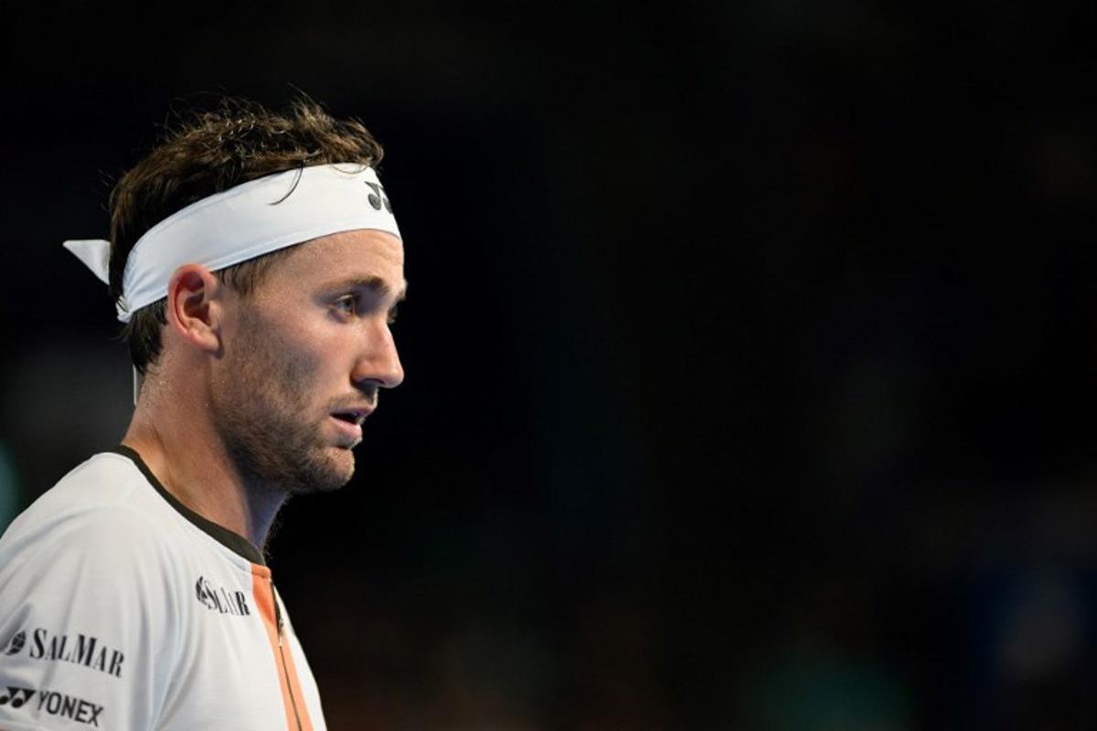 Norway's Casper Ruud looks on while competing against Spain's Carlos Alcaraz during their men's singles match at the ATP Japan Open tennis tournament in Tokyo on September 29, 2025. Philip FONG / AFP